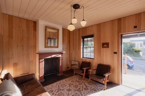 a living room with a couch and a fireplace at Richmond 1823 in Richmond