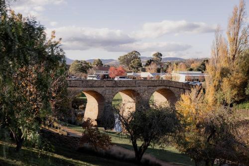a bridge over a river with a train on it at Richmond 1823 in Richmond