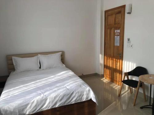 Postel nebo postele na pokoji v ubytování Hà Linh Hotel Vũng Tàu