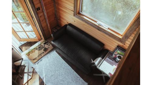 an overhead view of a couch in a tiny house at Little Blue Wren by Tiny Away in Yea