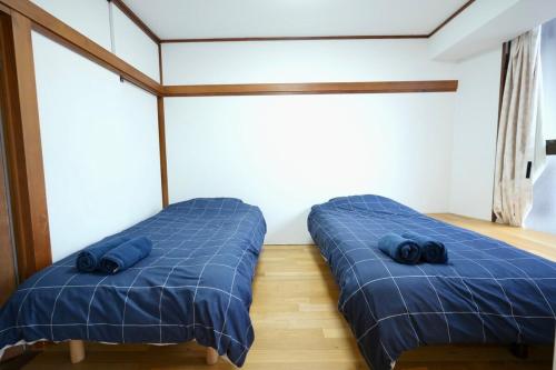 Postel nebo postele na pokoji v ubytování AMs house 5 min to Ikebukuro 13 min to Shinjuku Station 19 min to Shibuya Station