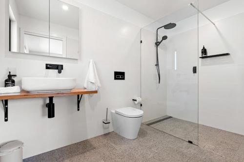 a bathroom with a shower and a toilet and a sink at The Derby Lodge 'One Bedroom' apartment retreat! in Derby