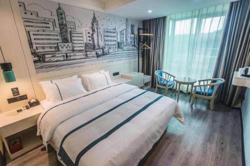 Postel nebo postele na pokoji v ubytování City Comfort Inn Shaoguan High-speed Railway Station Xilian Examination Center