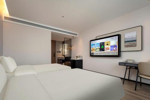 Postel nebo postele na pokoji v ubytování Atour Hotel Hangzhou Gongshu Asian Games Park