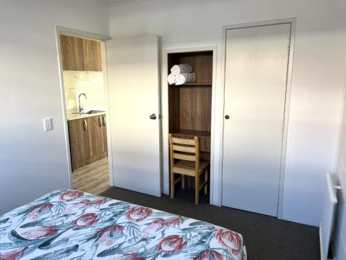 Ένα ή περισσότερα κρεβάτια σε δωμάτιο στο Rotorua Stay