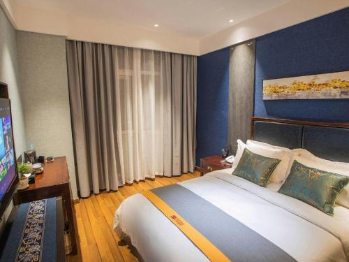Postel nebo postele na pokoji v ubytování Shell Hotel Tai'an Feicheng Longshan Road
