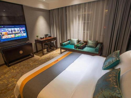 Postel nebo postele na pokoji v ubytování Shell Hotel Tai'an Feicheng Longshan Road
