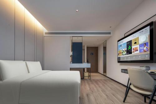TV a/nebo společenská místnost v ubytování Atour Hotel Hangzhou Gongshu Asian Games Park
