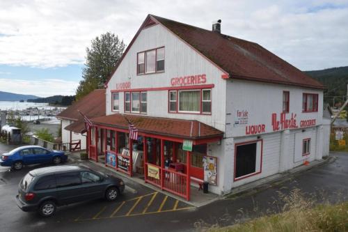 a car is parked in front of a building at Captain's Quarters - Reduced Price Tours! in Mendenhaven