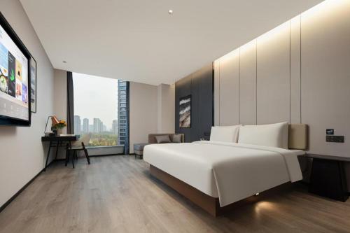 Postel nebo postele na pokoji v ubytování Atour Hotel Hangzhou Gongshu Asian Games Park