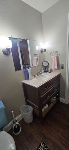 a bathroom with a sink and a mirror at Glacier Guest Room - PRIVATE ROOM IN SHARED HOUSE REDUCED PRICE ON TOURS in Juneau