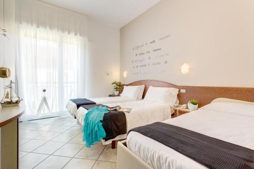Postel nebo postele na pokoji v ubytování B&B Isabella