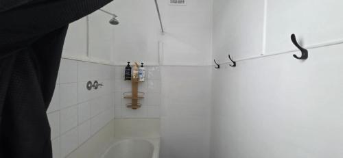 a bathroom with a shower with a tub and a toilet at National Smokehouse Hotel Coleraine in Coleraine