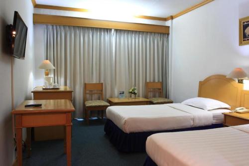Postel nebo postele na pokoji v ubytování Hotel Marcopolo