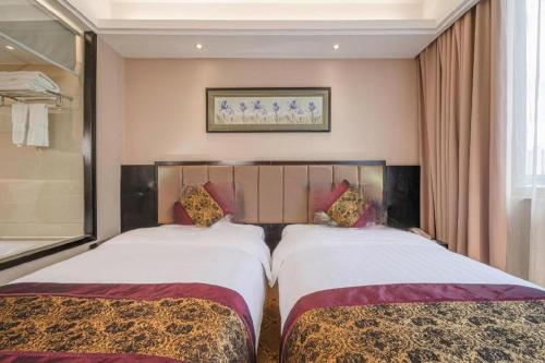Cama o camas de una habitación en Nanning Yongjiang Hotel