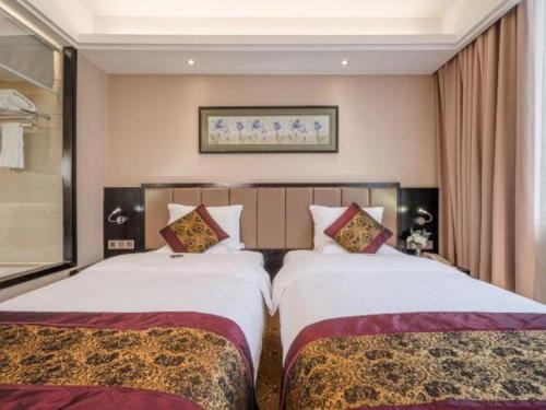 Cama o camas de una habitación en Nanning Yongjiang Hotel