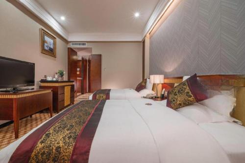 Cama o camas de una habitación en Nanning Yongjiang Hotel