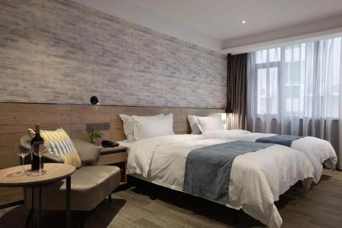 Cama o camas de una habitación en Shenzhen Hanyong Hotel Fuyong Branch