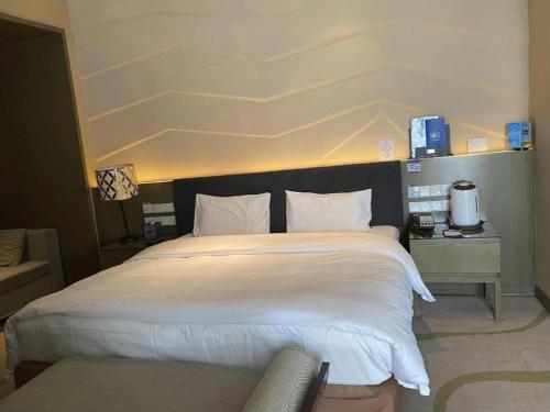 Letto o letti in una camera di Urumqi Tianyuan Hotel