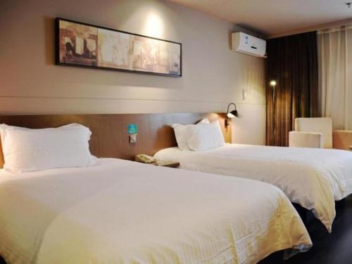 Katil atau katil-katil dalam bilik di Jinjiang Inn Select Nanjing South Railway Station North Square