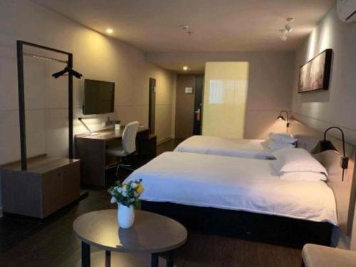 Katil atau katil-katil dalam bilik di Jinjiang Inn Select Nanjing South Railway Station North Square