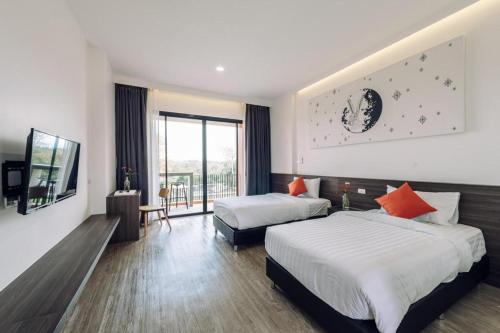 Postel nebo postele na pokoji v ubytování PIMDARA HOTEL