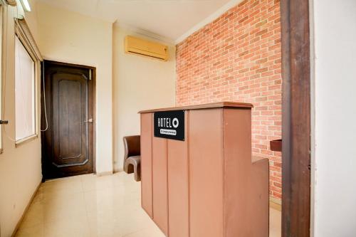 a utility box in a hallway with a brick wall at Super Hotel O Dera Bassi Ambala-Chandigarh Road in Chandīgarh