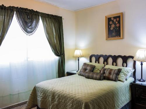 Ένα ή περισσότερα κρεβάτια σε δωμάτιο στο El paraíso de mi madre