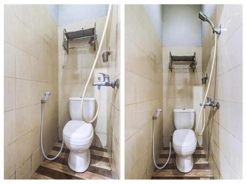 a bathroom with two toilets and a shower at OYO 91296 Nagoya Guesthouse in Nagoya