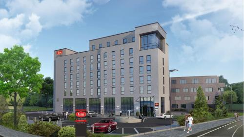 a rendering of a large building with a parking lot at Aiden by Best Western Velbert in Velbert