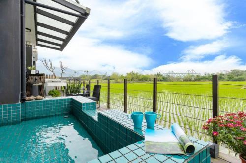 a swimming pool on the patio of a house at Hi Zebra Travel B&B in Dongshan
