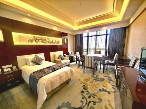 Katil atau katil-katil dalam bilik di New Century Hotel Zaozhuang Fengming