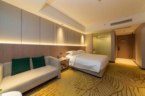 Ένα ή περισσότερα κρεβάτια σε δωμάτιο στο Forstar Hotel Renbei subbranch