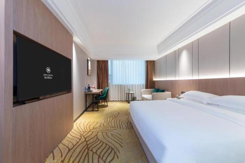 Ένα ή περισσότερα κρεβάτια σε δωμάτιο στο Forstar Hotel Renbei subbranch