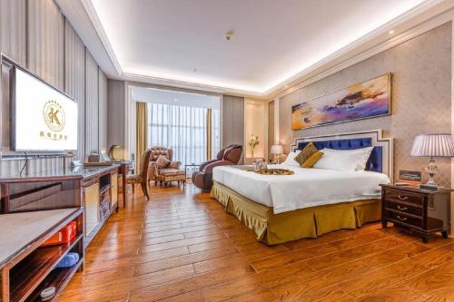 Ένα ή περισσότερα κρεβάτια σε δωμάτιο στο Kai Dun Hotel
