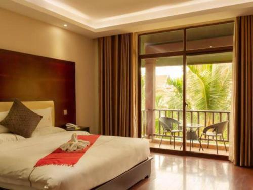 Ένα ή περισσότερα κρεβάτια σε δωμάτιο στο Xishuangbanna Hotel Managed by Xandria Hotel