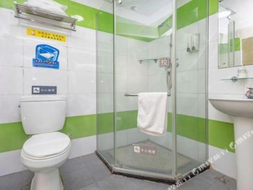 a bathroom with a toilet and a sink at 7 Days Inn Qingdao Shandong Road Zhenning Overpass Branch in Qingdao