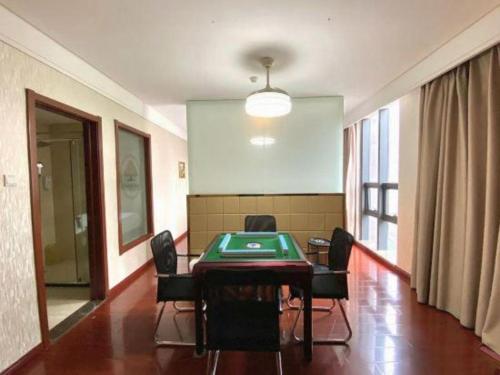 a conference room with a table and chairs in it at GreenTree Inn Hefei Huangshan Road Daxidi 1912 Express Hotel in Hefei