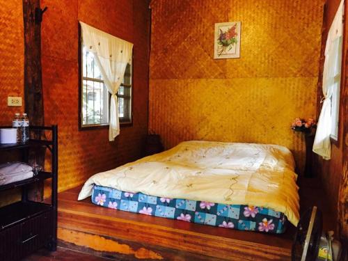 Postel nebo postele na pokoji v ubytování Chiang Dao Hut