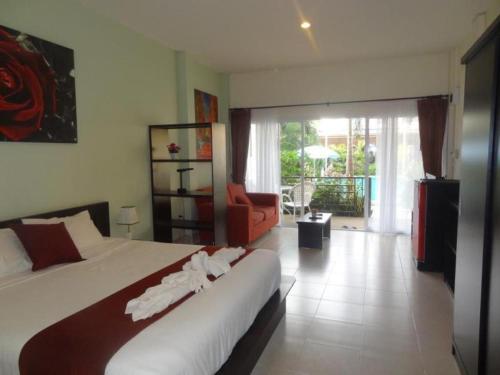 En eller flere senge i et værelse på Tulip Boutique Hotel