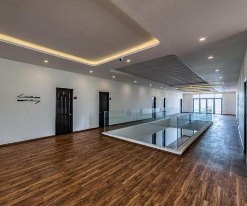 an empty room with a glass floor in a building at HON BA LAGI BEACH RESORT in La Gi