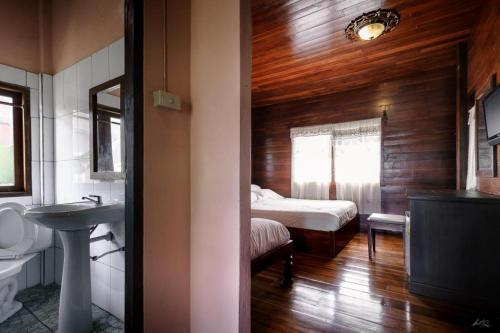 Postel nebo postele na pokoji v ubytování Huan Aumpron Resort