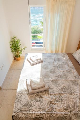 Postel nebo postele na pokoji v ubytování Adriatic Apartment