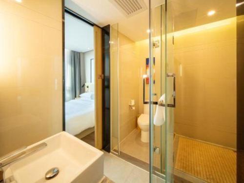 Koupelna v ubytování Echarm Hotel Yangjiang Baili Plaza