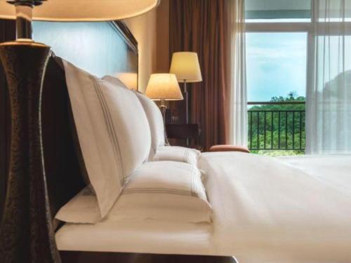 Letto o letti in una camera di Hongzhushan Hotel Mount Emei