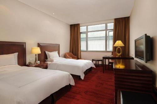 Letto o letti in una camera di Hongzhushan Hotel Mount Emei