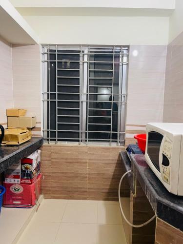 Kuchyň nebo kuchyňský kout v ubytování Uttara Premium Luxury Apartment