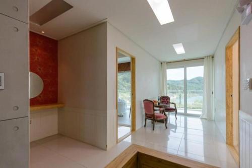 a kitchen and dining room with a table and chairs at All That Water Pension in Gapyeong