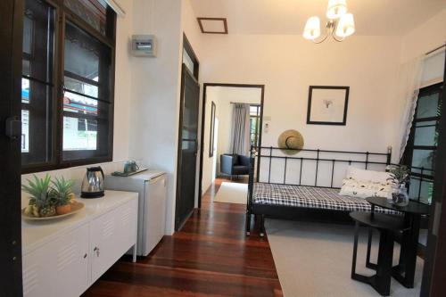 a living room with a bed and a table at Seascape Resort Baan Krood in Ban Krut