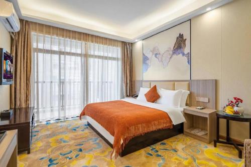 Postel nebo postele na pokoji v ubytování Oriental Hotel